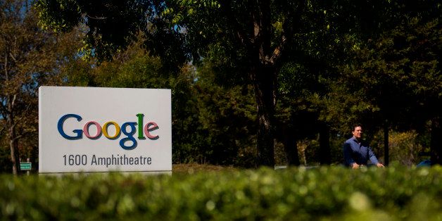 A bicyclist rides past a Google Inc. sign in front of the company's headquarters in Mountain View, California, U.S., on Friday, Sept. 27, 2013. Google is celebrating its 15th anniversary as the company reaches $290 billion market value. Photographer: David Paul Morris/Bloomberg via Getty Images