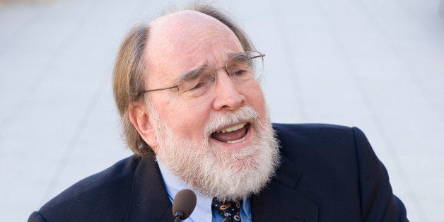 UNITED STATES - APRIL 17: Holding a Univ. of Hawaii football, Rep. Neil Abercrombie, D-Hawaii, participates in a news conference on a resolution calling for the Justice Department to investigate the college football's Bowl Championship Series to determine whether it constitutes an illegal restraint of trade, on the Cannon Terrace on Thursday, April 17, 2008. Also attending the event was Rep. Lynn Westmoreland, R-Ga. (Photo By Bill Clark/Roll Call/Getty Images)