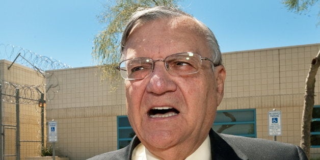 (FILES) Maricopa County Sheriff Joe Arpaio speaks with a reporter outside city jail in this May 3, 2010, file photo. The US Justice Department on May 10, 2012 sued Arpaio, his office and the county over civil rights violations involving racial profiling. AFP Photo/Paul J. Richards/FILES (Photo credit should read PAUL J. RICHARDS/AFP/GettyImages)