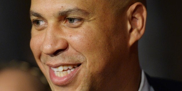 US Senator Cory Booker, D-NJ, smiles while posing for photos following a cermonial swearing-in in the Old Senate Chamber at t