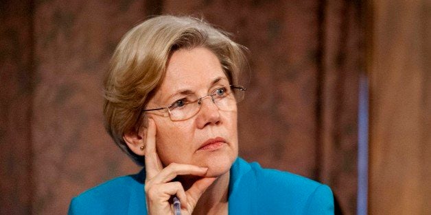 Senator Elizabeth Warren, a Democrat from Massachusetts, listens as Ben S. Bernanke, chairman of the U.S. Federal Reserve, not seen, answers a question during his semi-annual monetary policy report to the Senate Banking, Housing and Urban Affairs Committee during a hearing on Capitol Hill, in Washington, D.C., U.S., on Thursday, July 18, 2013. Bernanke said one reason for the recent rise in long-term interest rates is the unwinding of leveraged and 'excessively risky' investing. Photographer: Pete Marovich/Bloomberg via Getty Images 