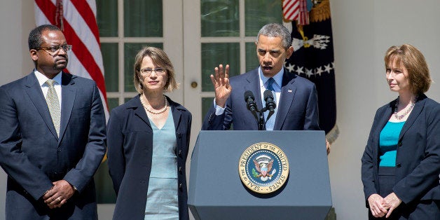 US President Barack Obama (C) gestures as he nominates Cornelia T. L. Pillard (R), a law professor; Patricia Ann Millett (2nd L), an appellate lawyer; and Robert L. Wilkins (L), a federal district judge, to fill the remaining vacancies on the United States Court of Appeals for the District of Columbia Circuit during an event in the Rose Garden at the White House in Washington, DC, June 4, 2013. AFP PHOTO/JIM WATSON (Photo credit should read JIM WATSON/AFP/Getty Images)