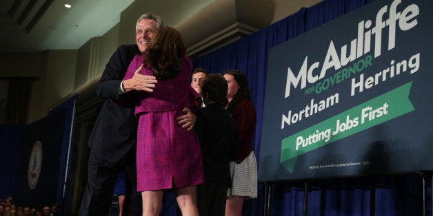 TYSONS CORNER, VA - NOVEMBER 05: Democrat Terry McAuliffe hugs his wife Dorothy after winning the Virginia governorship at an election-night party November 5, 2013 at Sheraton Premiere Hotel in Tysons Corner, Virginia. McAuliffe defeated Republican state Attorney General Ken Cuccinelli. (Photo by Alex Wong/Getty Images)