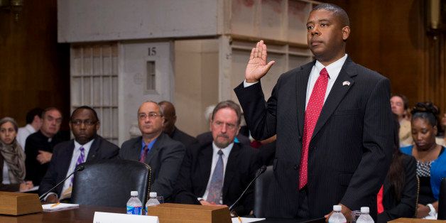 UNITED STATES - JUNE 19: Charles Samuels, director of the Federal Bureau of Prisons, is sworn in to a Constitution, Civil Rights and Human Rights Subcommittee hearing in Dirksen entitled 'Reassessing Solitary Confinement: The Human Rights, Fiscal and Public Safety Consequences.' A mock prison cell appears in the background. (Photo By Tom Williams/CQ Roll Call)