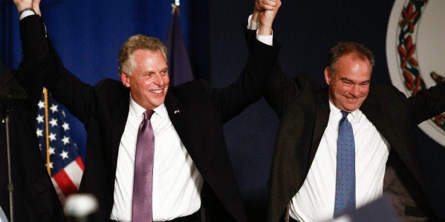 TYSONS CORNER, VA - NOVEMBER 5: (L-R), Virginia Governor-elect Terry McAuliffe (D) and Sen. Tim Kaine (D-VA) raise their hand