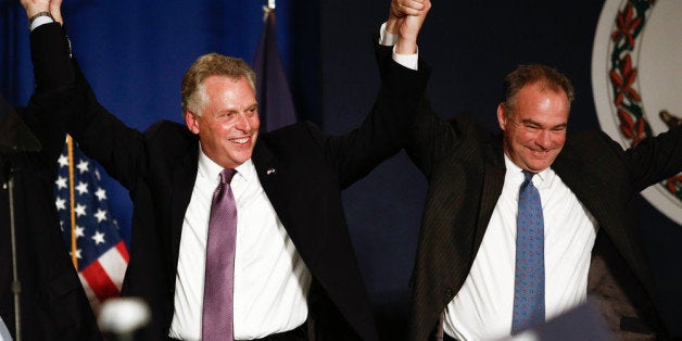 TYSONS CORNER, VA - NOVEMBER 5: (L-R), Virginia Governor-elect Terry McAuliffe (D) and Sen. Tim Kaine (D-VA) raise their hands together in celebration during an election night event, November 5, 2013 in Tysons Corner, Virginia. McAuliffe defeated state Attorney General Ken Cuccinelli. (Photo by Drew Angerer/Getty Images)