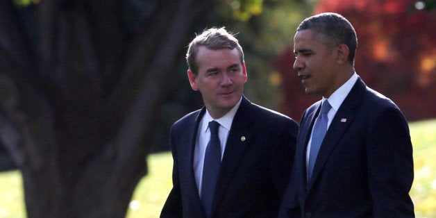 WASHINGTON, DC - NOVEMBER 06: U.S. President Barack Obama (R) walks with Sen. Michael Bennet (D-CO) toward Marine One to depart the White House November 6, 2013 in Washington, DC. President Obama is traveling to Dallas, Texas to attend fundraisers and talk about the Affordable Health Care Act. (Photo by Mark Wilson/Getty Images)