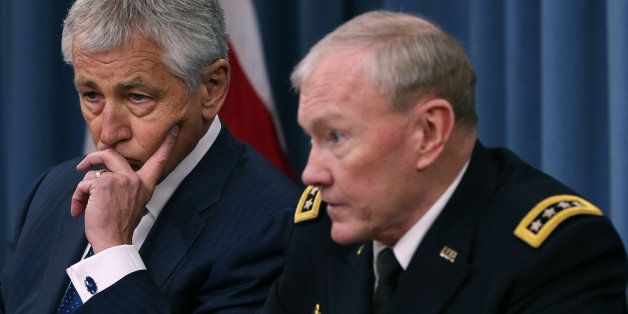 ARLINGTON, VA - APRIL 10: U.S. Defense Secretary Chuck Hagel (L), and Chairman of the Joint Chiefs of Staff Gen. Martin Dempsey talk about the Defense Department's FY2014 budget request during a briefing at the Pentagon, April 10, 2013 in Arlington, Virginia. Hagel also spoke about the ongoing situation with North Korea. (Photo by Mark Wilson/Getty Images)