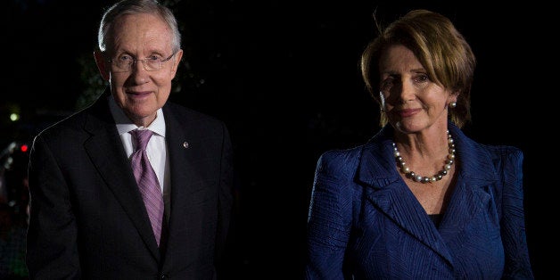 Senate Majority Leader Harry Reid, a Democrat from Nevada, left, and House Minority Leader Nancy Pelosi, a Democrat from California, walk towards the White House following a news conference after meeting with U.S. President Barack Obama in Washington, D.C., U.S., on Wednesday, Oct. 2, 2013. House Speaker John Boehner said Obama refused to negotiate in a meeting with top congressional leaders about the government shutdown, signaling a lack of progress on resolving the fiscal impasse. Photographer: Andrew Harrer/Bloomberg via Getty Images 