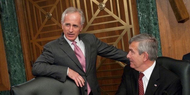 UNITED STATES - JANUARY 31: Sens. Bob Corker, R-Tenn., left, and Mike Johanns, R-Neb., talk before the start of a Senate Banking, Housing and Urban Affairs Committee hearing in Dirksen Building entitled 'Holding the CFPB (Consumer Financial Protection Bureau) Accountable: Review of First Semi-annual Report,' featuring testimony by Richard Cordray, director of the Consumer Financial Protection Bureau. (Photo By Tom Williams/CQ Roll Call)