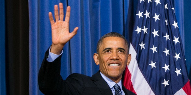 WASHINGTON, DC - NOVEMBER 13: U.S. President Barack Obama waves while attending the 2013 Tribal Nations Conference held at the Department of Interior Building on November 13, 2013 in Washington, DC. Obama meet with leaders of 566 Native American tribes earlier in the day at teh White House. (Photo by Kristoffer Tripplaar-Pool/Getty Images)