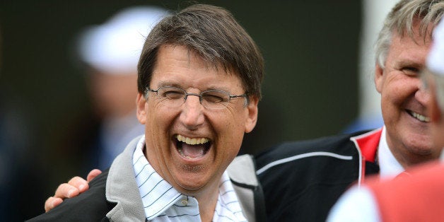 North Carolina Governor Pat McCrory enjoys a laugh at the 10th tee during the Pro-Am at Quail Hollow Club ahead of the Wells