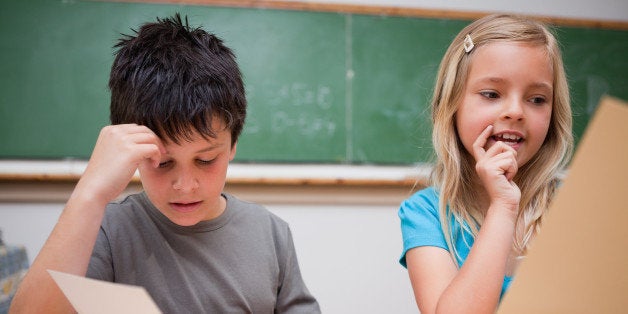 two children reading in a...