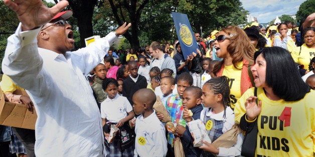 SLUG: me-vouchers DATE: Sep. 30, 2009, NW NEGATIVE #: 209962 Park near the Russell SOB CREDIT: Gerald Martineau-TWP rally for school vouchers Anti-voucher demonstrator Robert Brannum (left) tries to out-shout the person at the microphone and is met head-on by shouts of those in support of vouchers. (Photo by Gerald Martineau/The Washington Post/Getty Images)