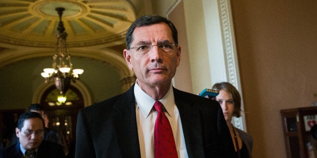 WASHINGTON, DC - OCTOBER 14: Sen. John Barrasso (R-WY) walks through the Capitol Building on October 14, 2013 in Washington,