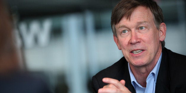 John Hickenlooper, governor of Colorado, speaks during an interview in Washington, D.C., U.S., on Wednesday, June 19, 2013. 'Were going to regulate the living daylights out of it,' Hickenlooper said speaking about marijuana regulation. Photographer: Julia Schmalz/Bloomberg via Getty Images