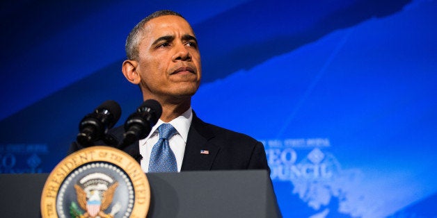 U.S. President Barack Obama pauses while speaking at the Wall Street Journal CEO Council annual meeting at the Four Seasons Hotel in Washington, D.C., on Tuesday, Nov. 19, 2013. Obama said the U.S. can cut the deficit and spur economic growth at the same time, and that short-term deficits aren't the nation's primary fiscal concern. Photographer: Drew Angerer/Bloomberg via Getty Images 