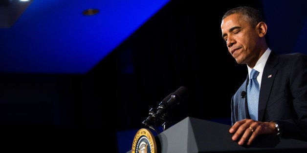 U.S. President Barack Obama pauses while speaking at the Wall Street Journal CEO Council annual meeting at the Four Seasons Hotel in Washington, D.C., on Tuesday, Nov. 19, 2013. Obama said the U.S. can cut the deficit and spur economic growth at the same time, and that short-term deficits aren't the nation's primary fiscal concern. Photographer: Drew Angerer/Bloomberg via Getty Images