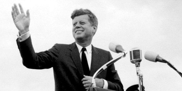 File photo dated 27/06/1963 of US President John F. Kennedy acknowledging the cheers of the crowd when he visits New Ross, Co. Wexford, Ireland as the world marks the 50th anniversary of the assassination of JFK.