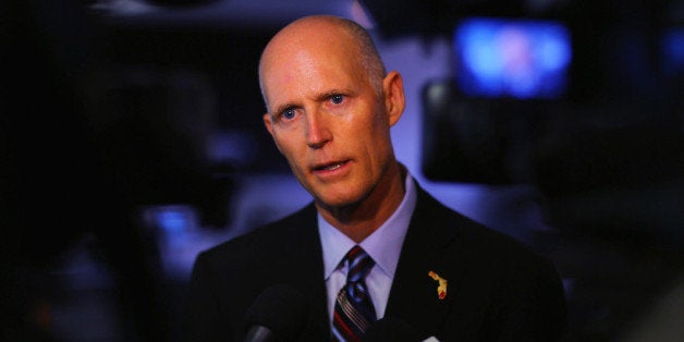 MIAMI, FL - JANUARY 10: Florida Governor Rick Scott speaks to the media after he toured the manufacturing facility at Beckman Coulter, a biomedical laboratory instruments manufacturer, on January 10, 2013 in Miami, Florida. The governor continues his push to create new business opportunities in the state and earlier in the week announced a plan to call on the State Legislature to eliminate the sales tax on equipment purchased by companies for their production plants. (Photo by Joe Raedle/Getty Images)