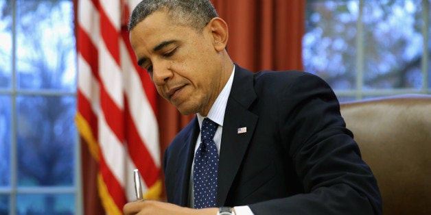 WASHINGTON, DC - NOVEMBER 27: U.S. President Barack Obama signs three bills into law on the Resolute Desk inside the Oval Office at the White House November 27, 2013 in Washington, DC. Obama signed S. 252, the Prematurity Research Expansion and Education for Mothers who deliver Infants Early Reauthorization Act or the 'PREEMIE Reauthorization Act'; H.R. 1848, the Small Airplane Revitalization Act of 2013; and H.R. 3204, the Drug Quality and Security Act . (Photo by Chip Somodevilla/Getty Images)