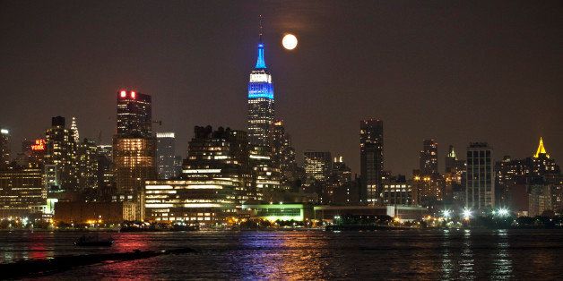 HOBOKEN, NJ - AUGUST 21: A full moon rises over the New York City skyline on August 21, 2013 as viewed from Hoboken, New Jersey. (Photo by Kena Betancur/Getty Images)