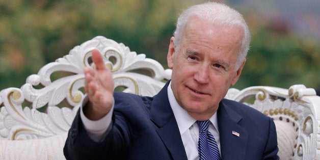 US Vice President Joe Biden gestures during a meeting with Chinese Vice President Li Yuanchao (unseen) after a welcoming ceremony at the Great Hall of the People in Beijing on December 4, 2013. Biden arrived in Beijing to raise concerns over a Chinese air zone ramping up regional tensions, looking to bolster ties while also underscoring alliances with Tokyo and Seoul. His trip follows weeks of furore after Beijing declared an 'air defence identification zone' (ADIZ) covering East China Sea islands disputed with Japan. AFP PHOTO / POOL (Photo credit should read LINTAO ZHANG/AFP/Getty Images)