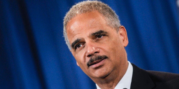 WASHINGTON, DC - SEPTEMBER 30: U.S. Attorney General Eric Holder speaks during a press conference announcing Department of Justice plans to sue North Carolina over Voter ID regulations at the Department of Justice on September 30, 2013 in Washington, DC. Under the new law North Carolina residents are required to show a photo ID at polling places which some believe threatens the voting rights of minorities. (Photo by Kris Connor/Getty Images)