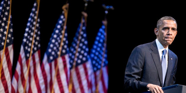 US President Barack Obama speaks at the Town Hall Education Arts Recreation Campus December 4, 2013 in Washington, DC. Obama on Wednesday returned to the core economic philosophy of middle class opportunity on which he has centered his presidency, as he strives to exit a second term slump. The US leader struck economic themes familiar from his two presidential campaigns as he sought to steady his administration after self-inflicted wounds over his health care law which have seen his popularity slide. AFP PHOTO/Brendan SMIALOWSKI (Photo credit should read BRENDAN SMIALOWSKI/AFP/Getty Images)