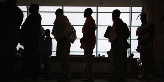 MIAMI, FL - MAY 02: People looking for work stand in line to apply for a job during a job fair at the Miami Dolphins Sun Life stadium on May 2, 2013 in Miami, Florida. If voters approve a hotel tax hike to fund stadium renovations the jobs would be available. If not, the Dolphins management is indicating they would not be able to renovate the stadium nor create the jobs. (Photo by Joe Raedle/Getty Images)