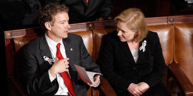 WASHINGTON, DC - JANUARY 25: (L-R) Sen. Rand Paul (R-KY) (L) and Sen. Kirsten Gillibrand (D-NY) talk before U.S. President Barack Obama's State of the Union address on Capitol Hill on January 25, 2011 in Washington, DC. Sen. Mark Udall (D-CO) first proposed bipartisan seating arrangements to foster a more cooperative spirit among lawmakers. (Photo by Chip Somodevilla/Getty Images)