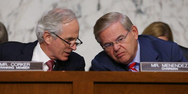 WASHINGTON, DC - SEPTEMBER 04: U.S. Sen. Bob Corker (R-TN) (L) talks with Chairman Robert Menendez (D-NJ) during a Senate Foreign Relations Committee vote on a resolution on Syria on Capitol Hill September 4, 2013 in Washington, DC. The Senate Foreign Relations Committee voted to authorize U.S. President Barack Obama to use limited force against Syria after adopting amendments from U.S. Sen. John McCain (R-NV). (Photo by Mark Wilson/Getty Images)