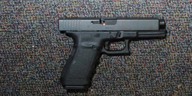 NEWTOWN, CT - UNSPECIFED DATE: In this handout crime scene evidence photo provided by the Connecticut State Police, shows a Glock 20, 10mm found near the shooter in Room 10 at Sandy Hook Elementary School following the December 14, 2012 shooting rampage, taken on an unspecified date in Newtown, Connecticut . A report was released November 25, 2013 by Connecticut State Attorney Stephen Sedensky III summarizing the Newtown school shooting that left 20 children and six women dead inside Sandy Hook Elementary School. According to the report, a motive behind the shooting by gunman Adam Lanza is still unknown. (Photo by Connecticut State Police via Getty Images)