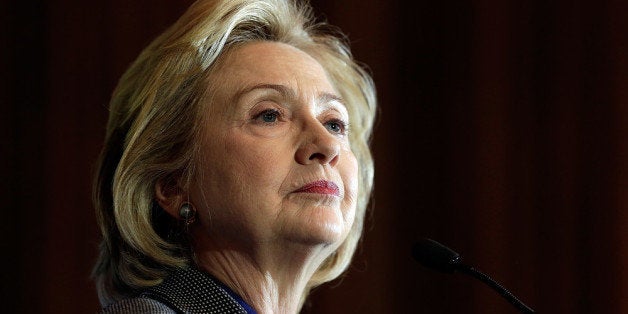 WASHINGTON, DC - DECEMBER 06: Former U.S. Secretary of State Hillary Clinton delivers remarks after being presented the 2013