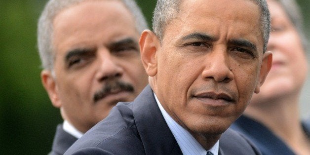 WASHINGTON, DC - MAY 15: (AFP OUT) (L-R) U.S. President Barack Obama, Attorney General Eric Holder and Secretary of Homeland Security Janet Napolitano look on during the 32nd annual National Peace Officers' Memorial Service at the West Front Lawn at the U.S. Capitol May 15, 2013 in Washington, DC. President Barack Obama delivered remarks at the event, invoking the law enforcement officers who worked to bring the Boston Marathon bombing suspects to justice. (Photo by Olivier Douliery - Pool/Getty Images)