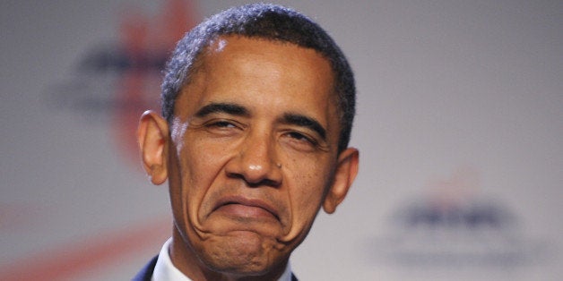 US President Barack Obama, speaking of receiving injections, frowns while addressing the American Nurses Association House of