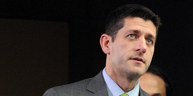 US Rep. Paul Ryan, R-WI, walks to a meeting at the Capitol Hill in Washington, DC, on October 16, 2013. Senate Majority Leade