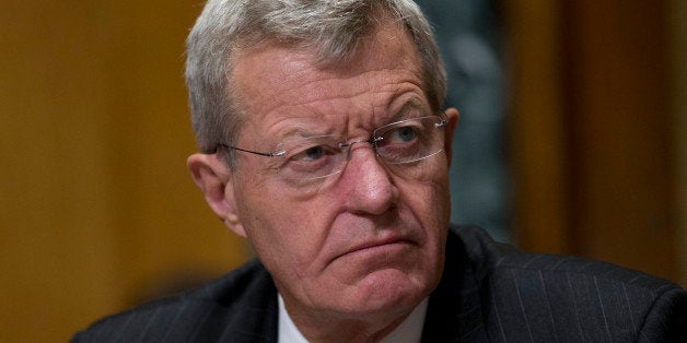 Senator Max Baucus, a Democrat from Montana and chairman of the Senate Finance Committee, listens during a hearing with Kathl