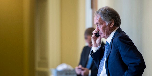 UNITED STATES - SEPTEMBER 17: Sen. Ed Markey, D-Mass., talks on his cell phone outside of the Senate Democrats' policy lunch in the Capitol on Tuesday, Sept. 17, 2013. (Photo By Bill Clark/CQ Roll Call)