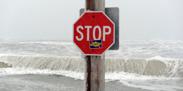 WINTHROP, MA - FEBRUARY 09: The ocean overflows the sea wall on Winthrop Shore Drive February 9, 2013 in Winthrop, Massachusetts. An overnight blizzard left one to two feet of snow in areas, and coastal flooding is expected as the storm lingers into the day. (Photo by Darren McCollester/Getty Images)