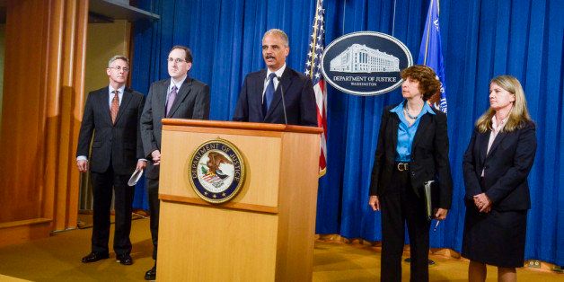 WASHINGTON, DC - SEPTEMBER 30: (L-R) U.S. Attorney for the Eastern District of North Carolina Thomas G. Walker, U.S. Attorney for the Middle District of North Carolina Ripley Rand, U.S. Attorney General Eric Holder, Senior Counselor Jocelyn Samuels and U.S. Attorney for the Western District of North Carolina Ann Tompkins hold a press conference announcing Department of Justice plans to sue North Carolina over Voter ID regulations at the Department of Justice on September 30, 2013 in Washington, DC. Under the new law North Carolina residents are required to show a photo ID at polling places which some believe threatens the voting rights of minorities. (Photo by Kris Connor/Getty Images)