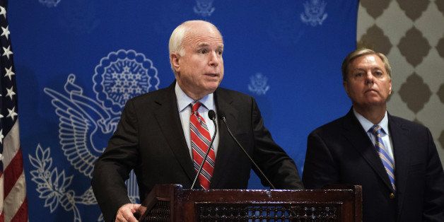 US Republican Senator John McCain (L) and Republican Senator Lindsey Graham (R) address a news conference on August 6, 2013 in Cairo, Egypt. The two leading US Senators urged Egypt's leaders to engage in an 'inclusive' dialogue with supporters of ousted president Mohamed Morsi as a way out of the crippling political crisis. AFP PHOTO/GIANLUIGI GUERCIA (Photo credit should read GIANLUIGI GUERCIA/AFP/Getty Images)