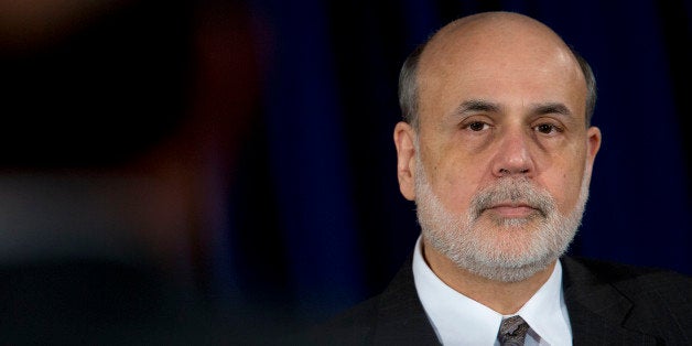 Ben S. Bernanke, chairman of the U.S. Federal Reserve, listens to a question during a news conference following a Federal Open Market Committee (FOMC) meeting in Washington, D.C., U.S., on Wednesday, Dec. 18, 2013. The Federal Reserve is cutting its monthly bond purchases to $75 billion from $85 billion, taking its first step toward unwinding the unprecedented stimulus that Bernanke put in place to help the economy recover from the worst recession since the 1930s. Photographer: Andrew Harrer/Bloomberg via Getty Images