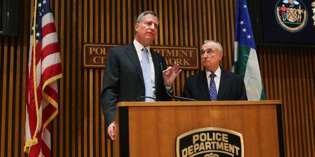 NEW YORK, NY - JANUARY 02: New York City Mayor Bill de Blasio (left) speaks at his first news conference with police commissioner William Bratton at One Police Plaza on January 2, 2014 in New York City. New York City, and much of New England is preparing for a major winter snowstorm. (Photo by Spencer Platt/Getty Images)