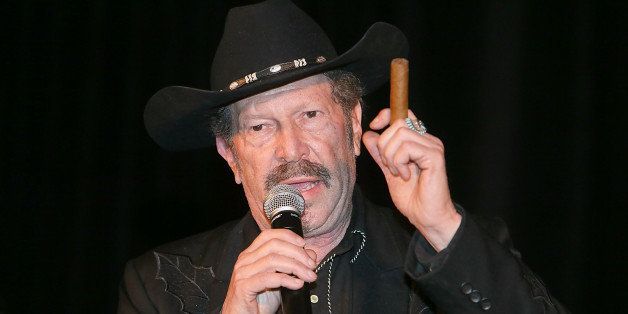 AUSTIN, TX - FEBRUARY 10: Kinky Friedman speaks during the Nobelity Projects Artists and Filmmakers Dinner honoring Kris Kristofferson with the Feed The Peace award at the Four Seasons Hotel on February 10, 2013 in Austin, Texas. (Photo by Gary Miller/FilmMagic)