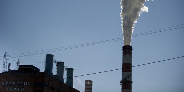 NEW EAGLE, PA - SEPTEMBER 24: A plume of exhaust extends from the Mitchell Power Station, a coal-fired power plant located 20 miles southwest of Pittsburgh, on September 24, 2013 in New Eagle, Pennsylvania. The plant, owned by FirstEnergy, will be one of two plants in the region to be shut down, affecting 380 employees. The Evironmental Protection Agency (EPA) and the Obama administration have been taking major steps to get coal-fired power plants into compliance with clean air regulations. (Photo by Jeff Swensen/Getty Images)