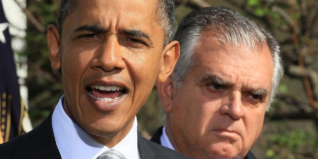 WASHINGTON - OCTOBER 11: U.S. President Barack Obama (L) speaks while flanked by Secretary of Transportation Ray LaHood (R) d