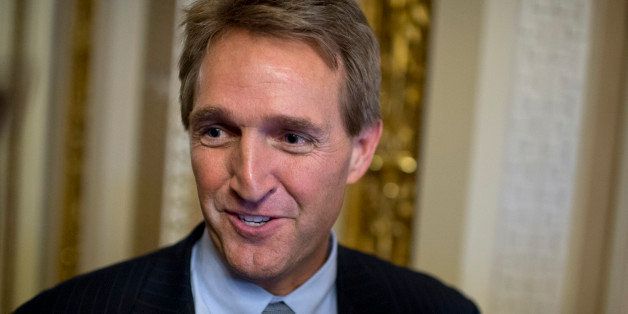UNITED STATES - NOVEMBER 21: Sen. Jeff Flake, R-Ariz., speaks to reporters in the Capitol after a vote in the Senate to end the minoritys ability to filibuster and kill most presidential nominations. (Photo By Tom Williams/CQ Roll Call)
