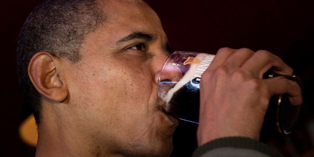 US President Barack Obama drinks a Guinness beer at The Dubliner pub on March 17, 2012 in Washington. Obama went to the bar to celebrate St. Patrick's Day. AFP PHOTO/Brendan SMIALOWSKI (Photo credit should read BRENDAN SMIALOWSKI/AFP/Getty Images)