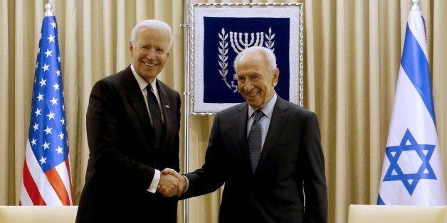 Israeli President Shimon Peres shakes hands with US Vice President Joe Biden at the presidential compound in Jerusalem on January 13, 2014. Biden earlier in the day spoke at the funeral of former Israeli prime minister Ariel Sharon remembering him as a 'historic leader' whose guiding star was 'the survival of the state of Israel and the Jewish people.' AFP PHOTO/GALI TIBBON (Photo credit should read GALI TIBBON/AFP/Getty Images)
